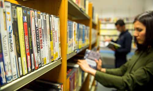 girl at DVD shelves